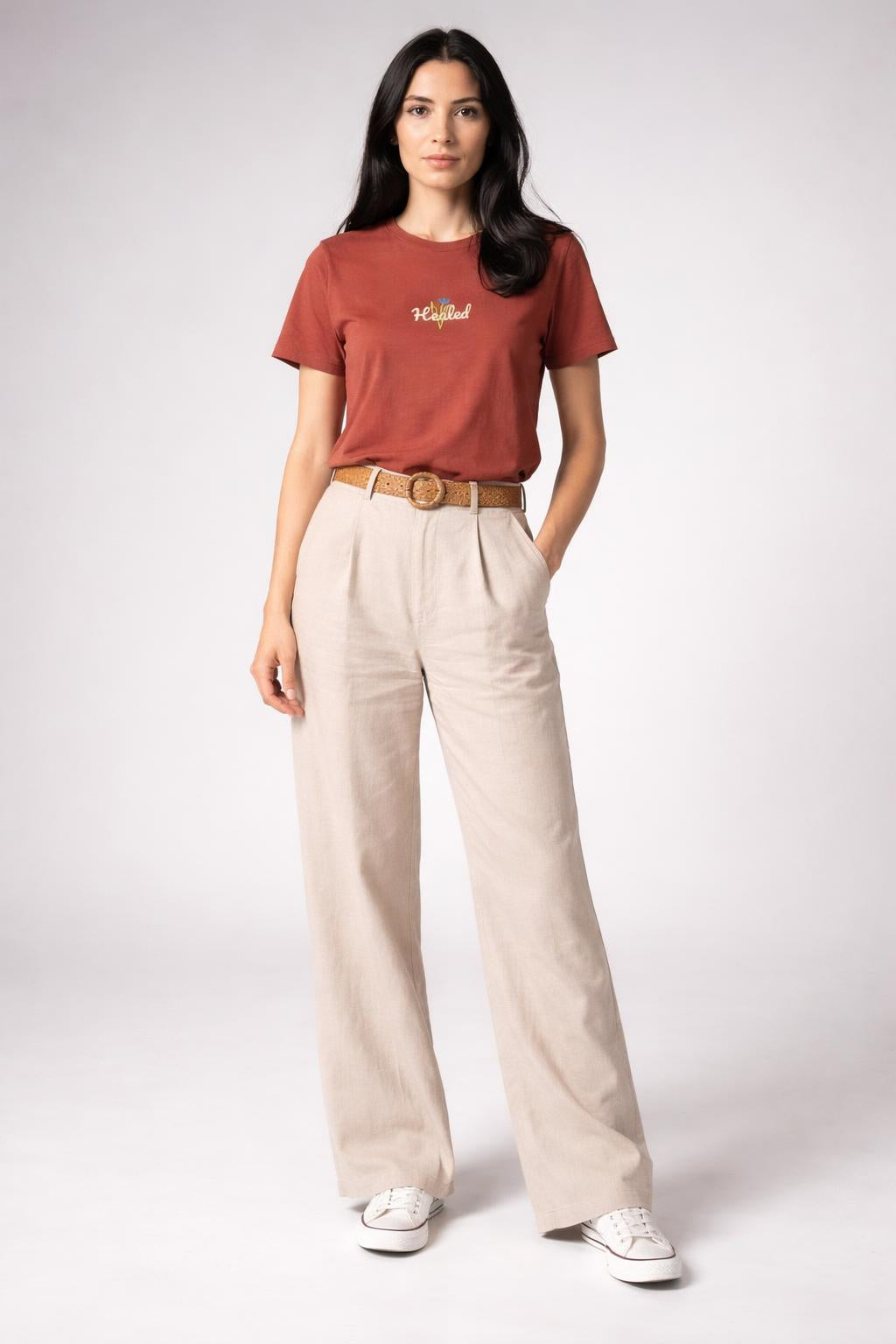 Full body view of the model wearing HEALED t-shirt