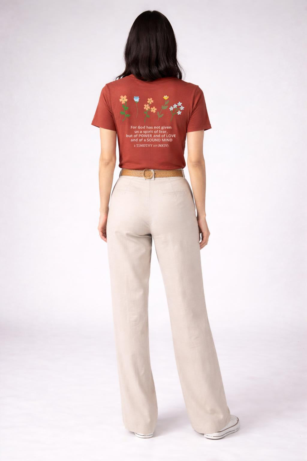 Back pose of the model wearing HEALED t-shirt