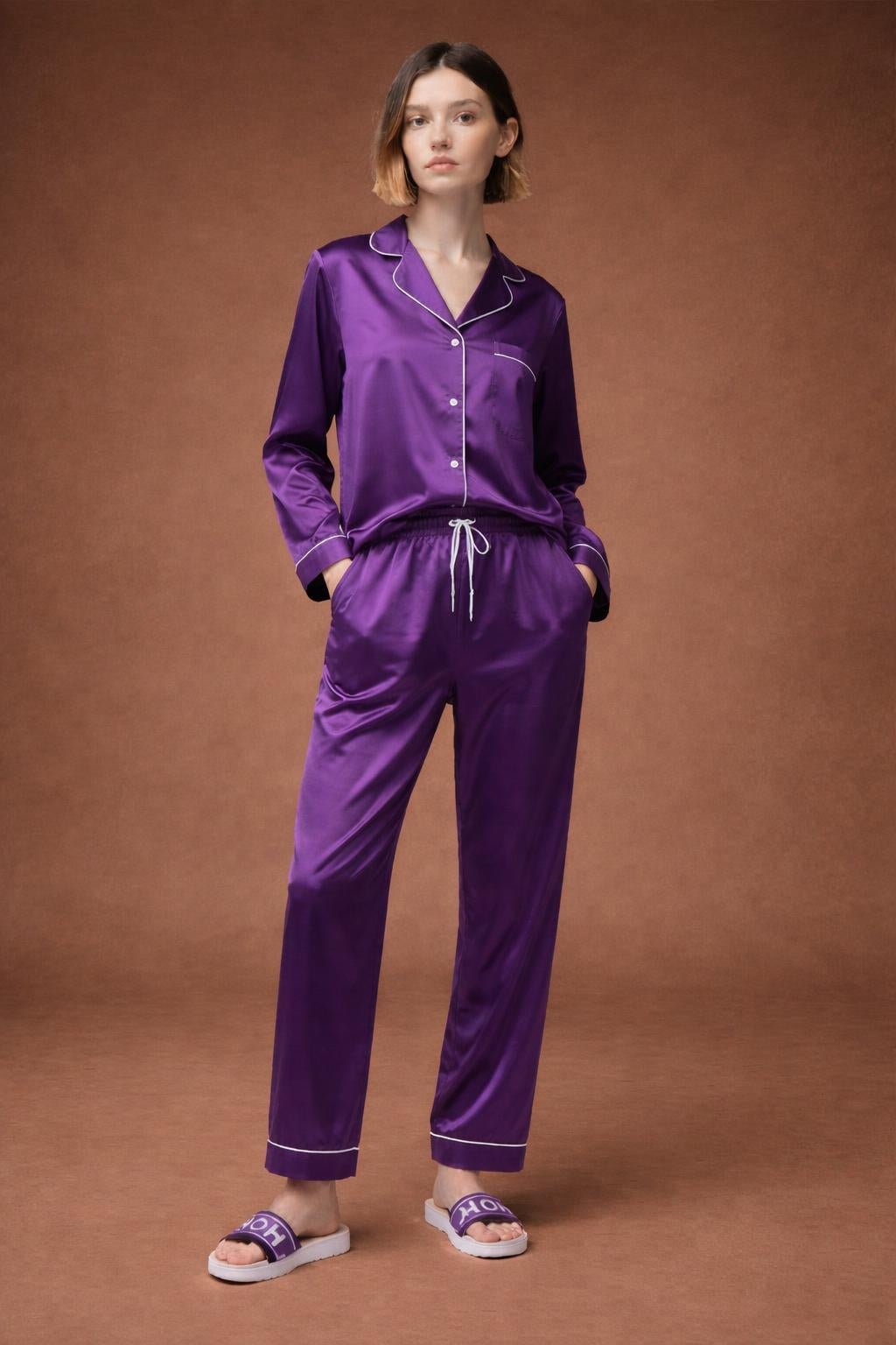 Full body view of the model wearing HOLY slides